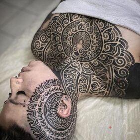 Tattoo Hit me with something small behind the ear on the face motif: black and gray style: geometric