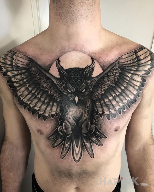 Tattoo Posępna sowa in black and gray motif and realistic style on the collarbone