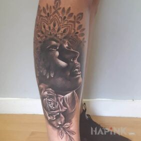 Tattoo Realistic face mandala on the leg motif: 3D style: realistic