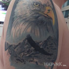 Tattoo Eagle on the upper arm motif: colorful style: realistic