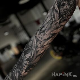 Tattoo Nordic themed sleeve on the upper arm motif: angels style: Celtic / Nordic