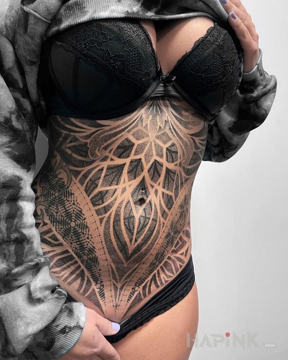 Tattoo Kropka do kropeczki in black and gray motif and dotwork style on the stomach