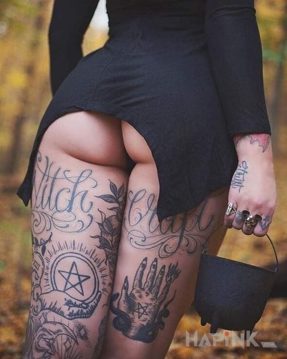 Tattoo Witch girl in lettering motif and calligraphy style on the thigh