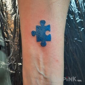 Tattoo Autism on the throat motif: other style: minimalistic