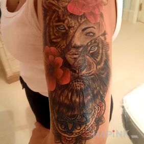 Tattoo Tiger, flowers, face and mandala On the arm motif: colorful style: graphic / illustrative