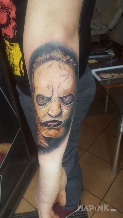 Tattoo Slipknot in characters motif on the forearm