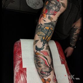 Tattoo Wolf in the sleeve on the forearm motif: floral style: neo-traditional