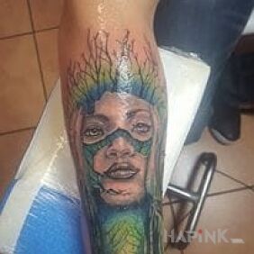 Tattoo Fantasy on the forearm motif: faces
