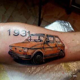 Tattoo Fiat on the forearm style: realistic