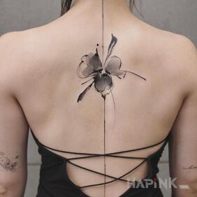 Tattoo A Stain or a Flower? on the back motif: flowers style: Watercolor