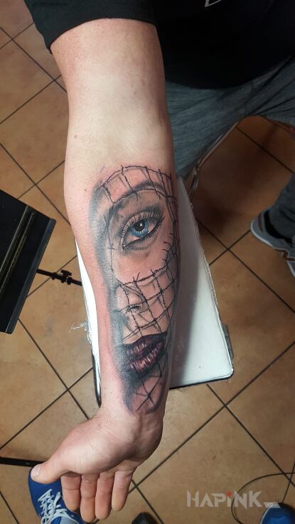 Tattoo Muerte in faces motif and realistic style on the forearm