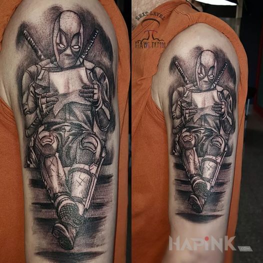 Tattoo DEADPOOL in characters motif and realistic style On the arm