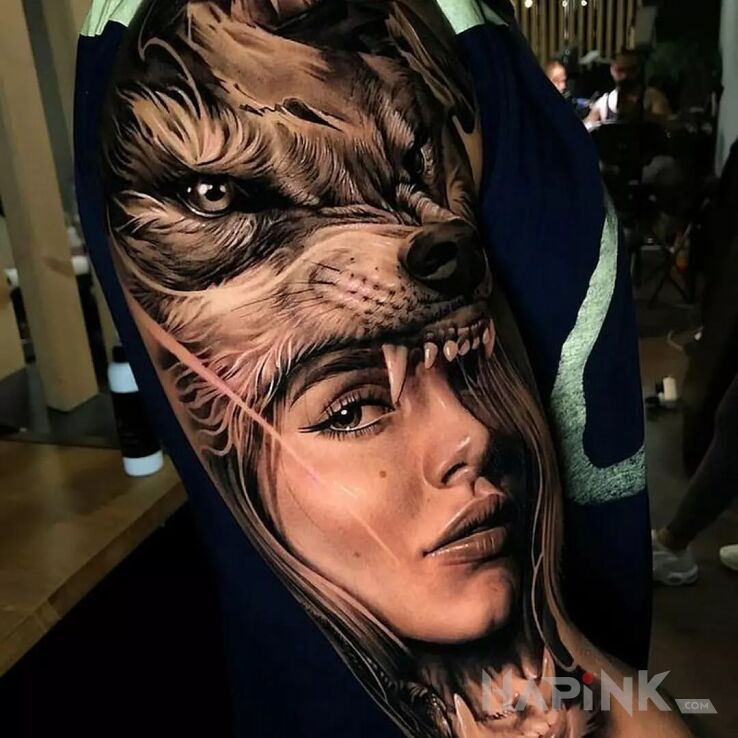 Tattoo Dziewczyna w wilczej skórze in faces motif and realistic style On the arm