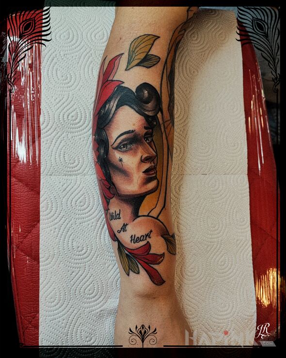 Tattoo Wild at heart in floral motif and neo-traditional style On the arm