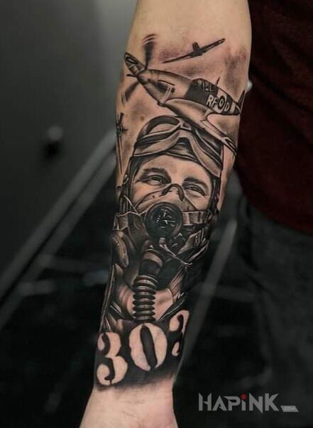 Tattoo Dywizjon 303 in black and gray motif and realistic style On the arm