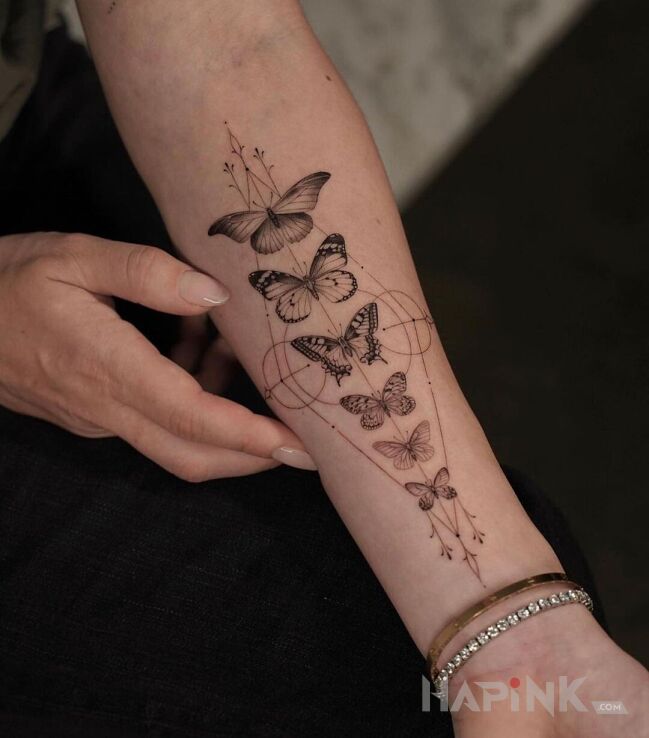 Tattoo 6 motyli in butterflies motif and realistic style on the forearm
