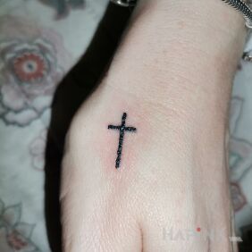 Tattoo Cross on the hand motif: religious style: minimalistic