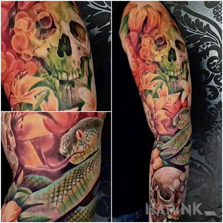 Tattoo Colorful sleeve snake flowers in sleeves motif and realistic style on the upper arm