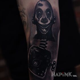 Tattoo Horror on the forearm motif: demons style: realistic