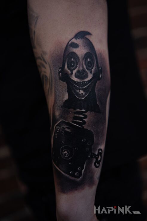 Tattoo Horror in black and gray motif and realistic style On the arm