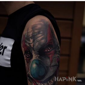 Tattoo Horror on the upper arm motif: colorful style: realistic