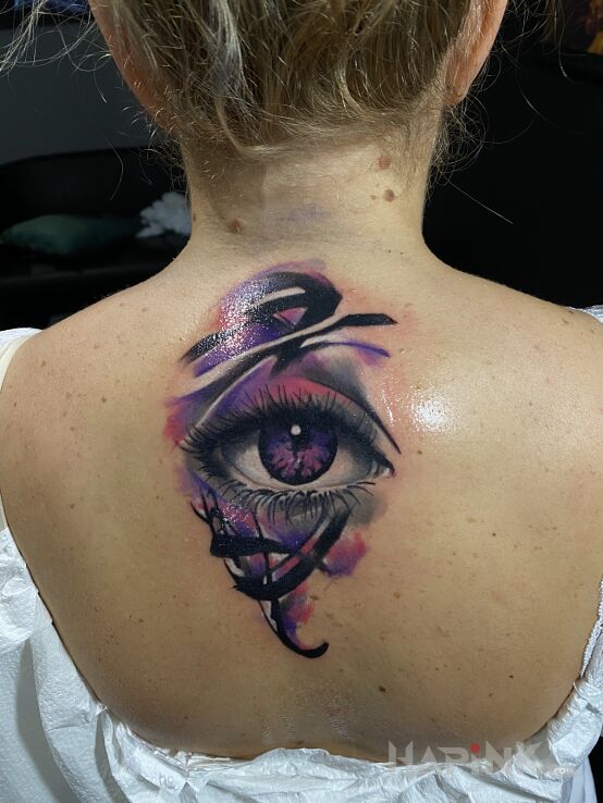 Tattoo Oko in other motif and abstract style on the back