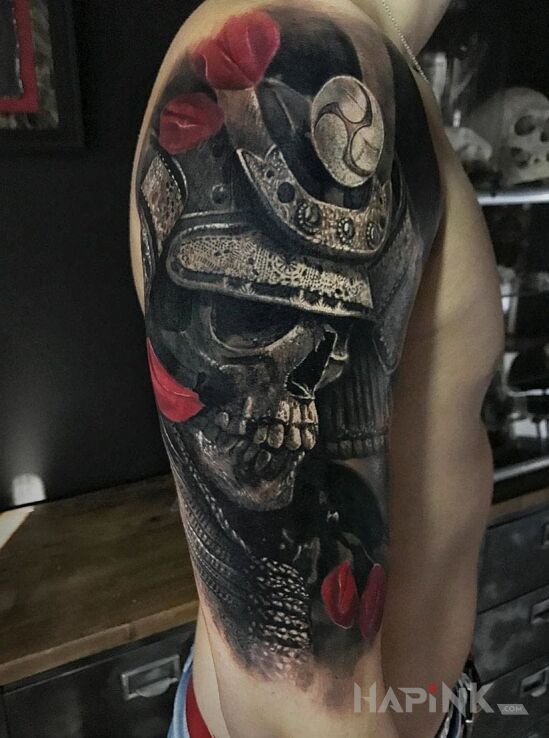 Tattoo Samuraj in skulls motif and realistic style on the upper arm