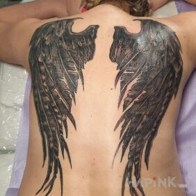 Tattoo Wings on the back motif: black and gray style: graphic / illustrative