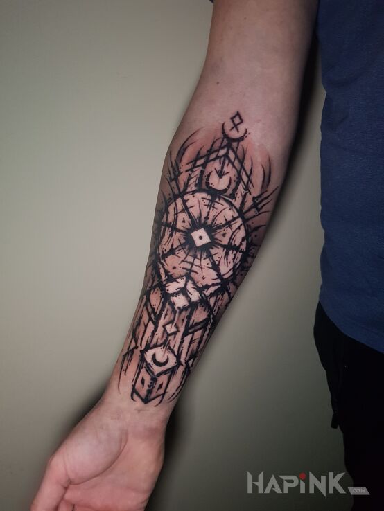 Tattoo Nordycki motyw in black and gray motif and graphic / illustrative style On the arm