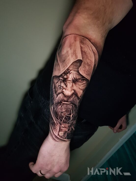 Tattoo Dziadek in black and gray motif and realistic style on the forearm