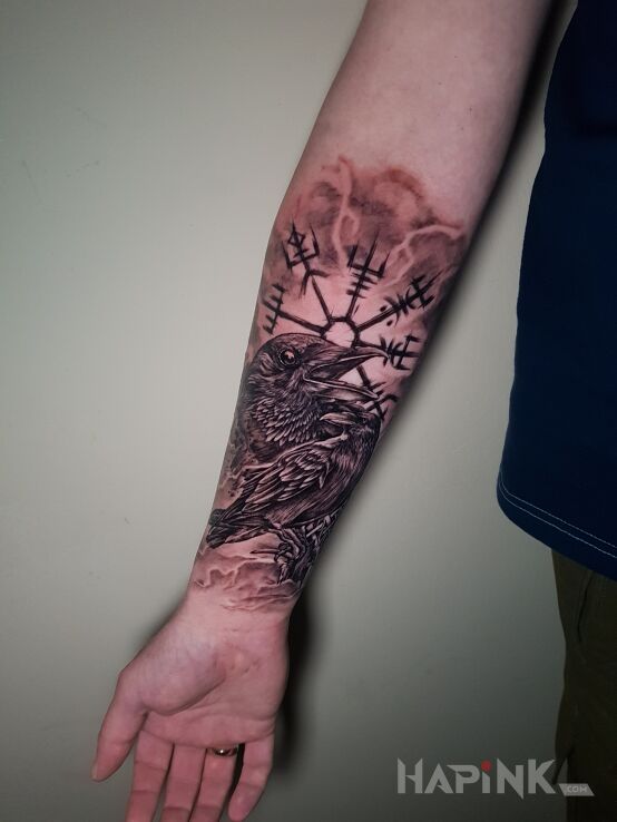 Tattoo Kruki in black and gray motif and calligraphy style On the arm