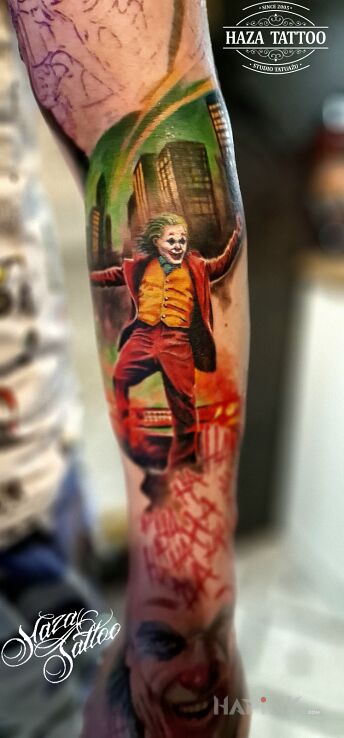 Tattoo Joker in characters motif and realistic style On the arm