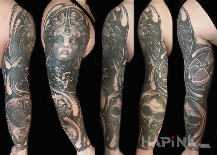 Tattoo Atomica in black and gray motif and realistic style on the bicep