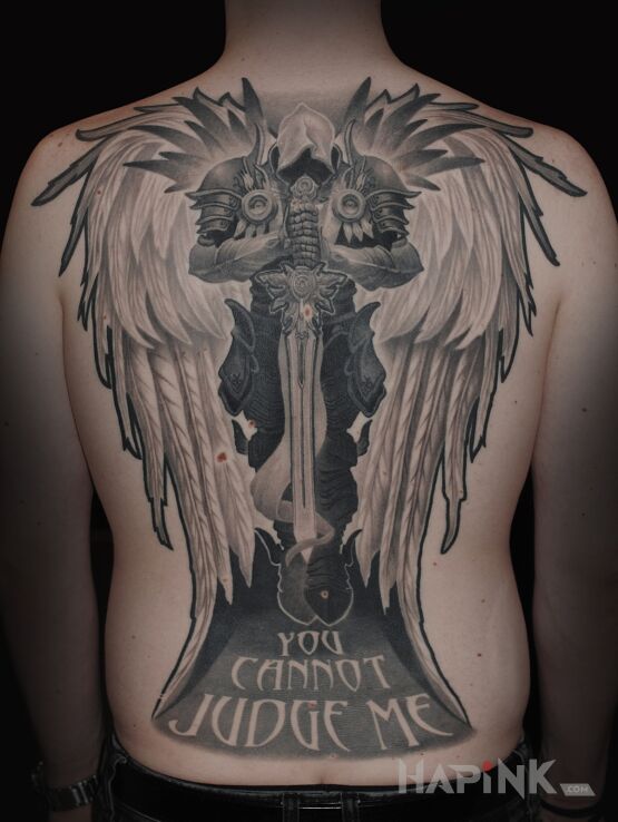Tattoo Tyraell in wings motif and graphic / illustrative style on the shoulder blades