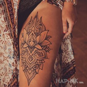 Tattoo Lotus flower on the leg motif: black and gray style: graphic / illustrative
