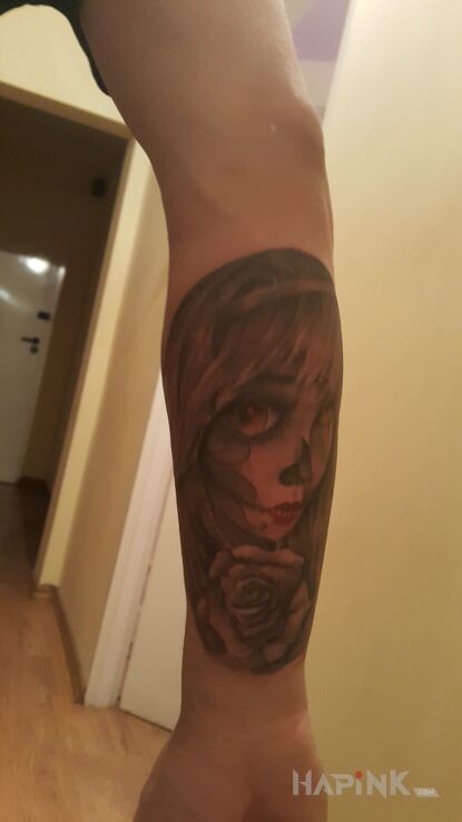 Tattoo Mexican child in characters motif on the forearm