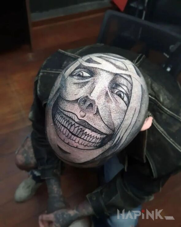 Tattoo Śmieszek in black and gray motif and graphic / illustrative style on the head