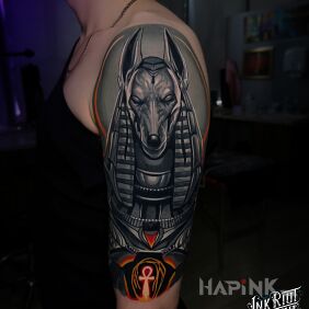 Tattoo Anubis on the upper arm motif: fantasy style: realistic