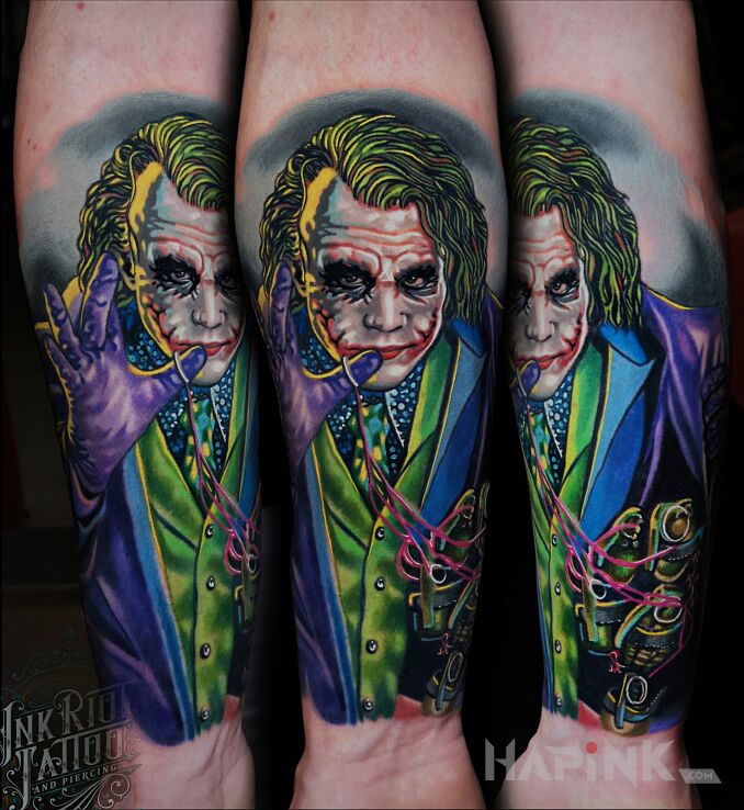 Tattoo Joker in characters motif and realistic style On the arm