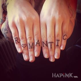 Tattoo Romantic on the fingers motif: lettering