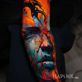 Tattoo Spilled face on the forearm motif: faces style: abstract