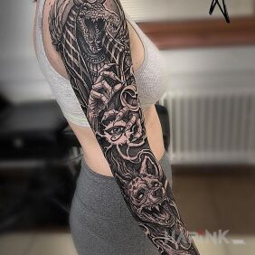 Tattoo Mr crocodile on the forearm motif: black and gray style: graphic / illustrative