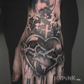 Tattoo Wear your heart on your sleeve on the hand motif: religious style: surrealistic