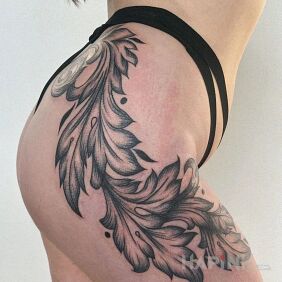 Tattoo Piece of a leaf on the hip motif: floral style: graphic / illustrative