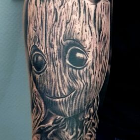 Tattoo Groot on the forearm motif: black and gray style: realistic