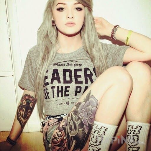 Tattoo Blondi in flowers motif on the forearm