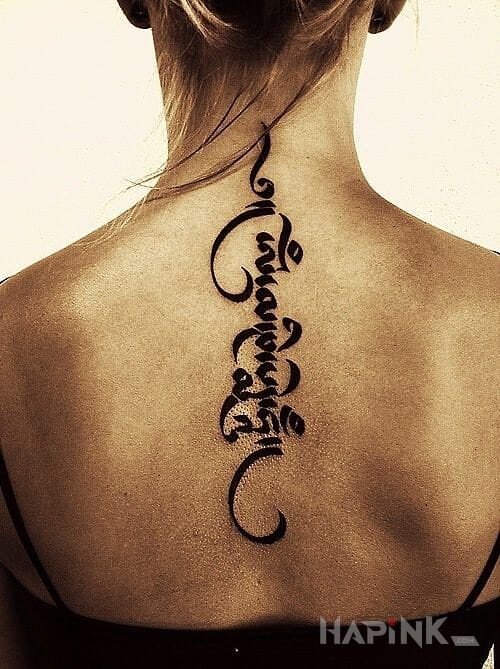 Tattoo Zagadka in lettering motif on the back