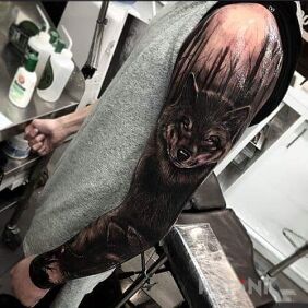 Tattoo Wolf in the dark on the forearm motif: sleeves