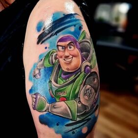 Tattoo Astral Buzz On the arm motif: colorful style: cartoon / comic book