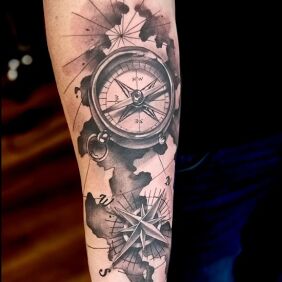 Tattoo Compass and wind rose on the forearm motif: objects style: realistic
